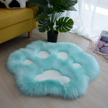 Light aqua faux fur cat paw area rug with white paw pad details
