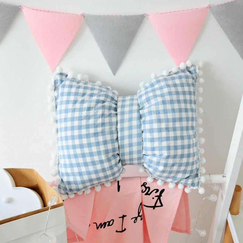 Blue and white gingham bow-shaped decorative pillows with pom trim, two-piece set
