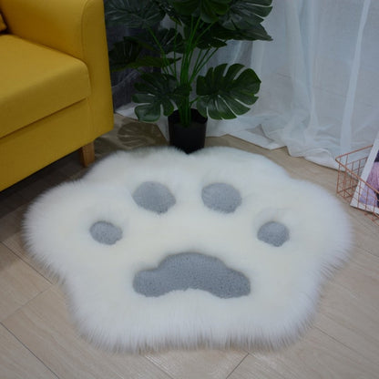 White faux fur round cat paw rug with gray paw pad details