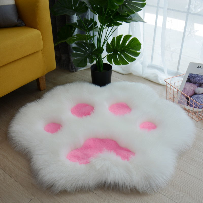 White faux fur round cat paw area rug with pink paw pad details
