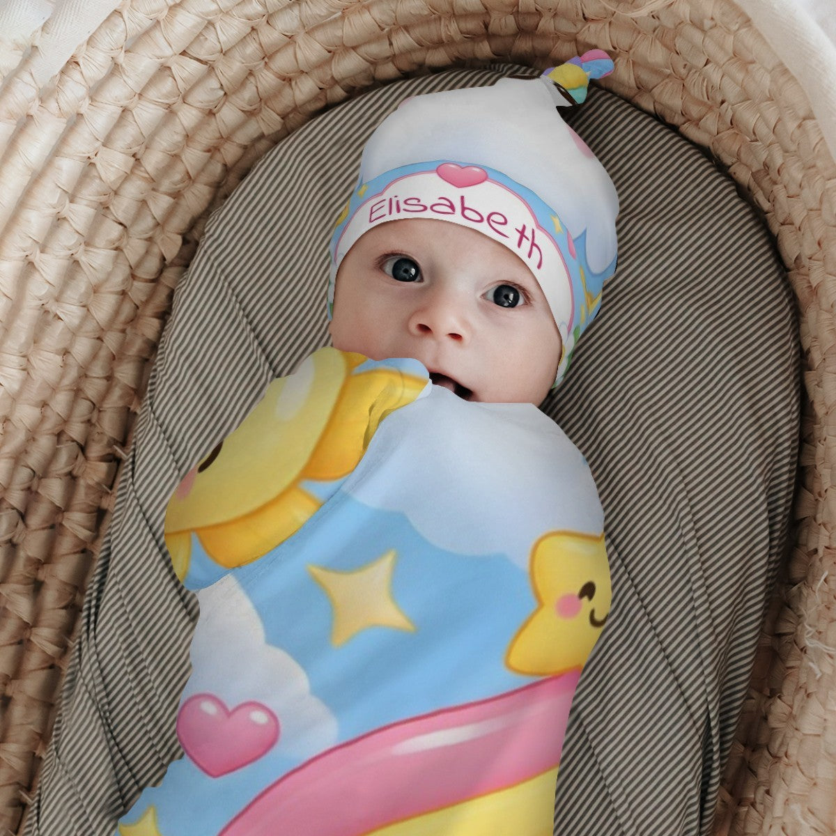 Baby swaddled in rainbow cloud blanket with matching hat, embroidered name Elisabeth