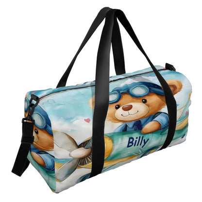 Blue teddy bear duffel bag with cartoon 'Billy' graphic and black top handles.