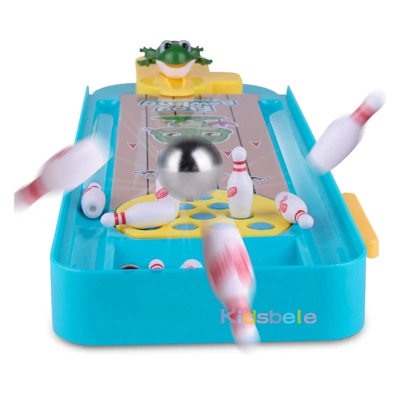 Mini bowling board game toy with frog catapult, bowling pins, and metal ball on tray