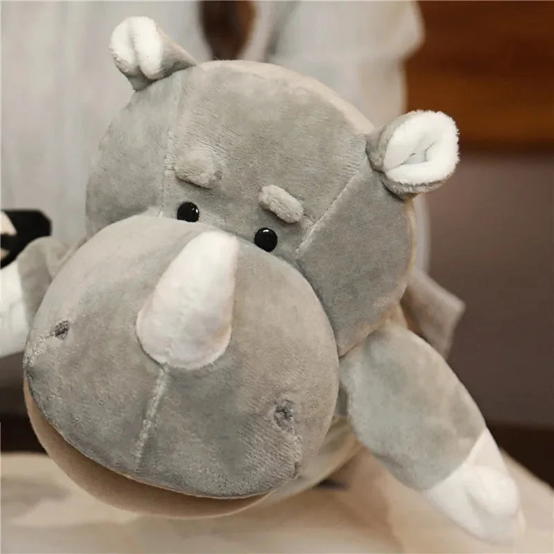Gray rhino finger puppet plush with white ear tips and dark eyes