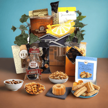 Gift basket with house-shaped box of snacks, tea, peanuts, caramel cookies