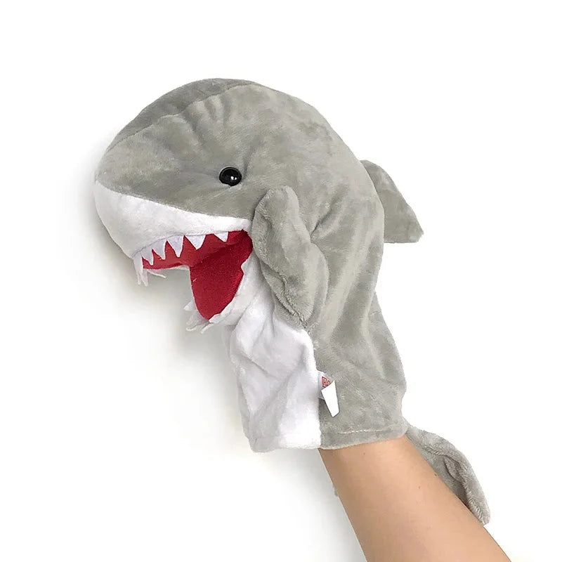 Shark finger story puppet toy, gray plush with red open mouth and white teeth.