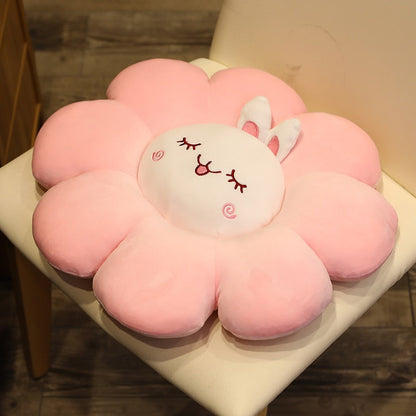 Light pink plush flower pillow with white bunny face and stitched ear details