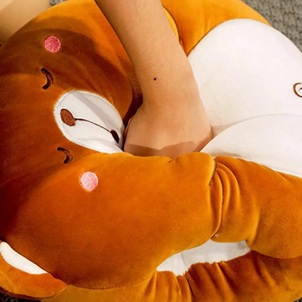 Orange plush cushion blanket with mouse-like face patch, pink dots, and curled tail applique