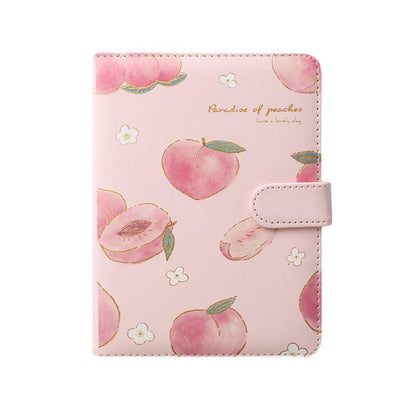 Peach-themed notebook cover with multiple peaches pattern and a white snap strap