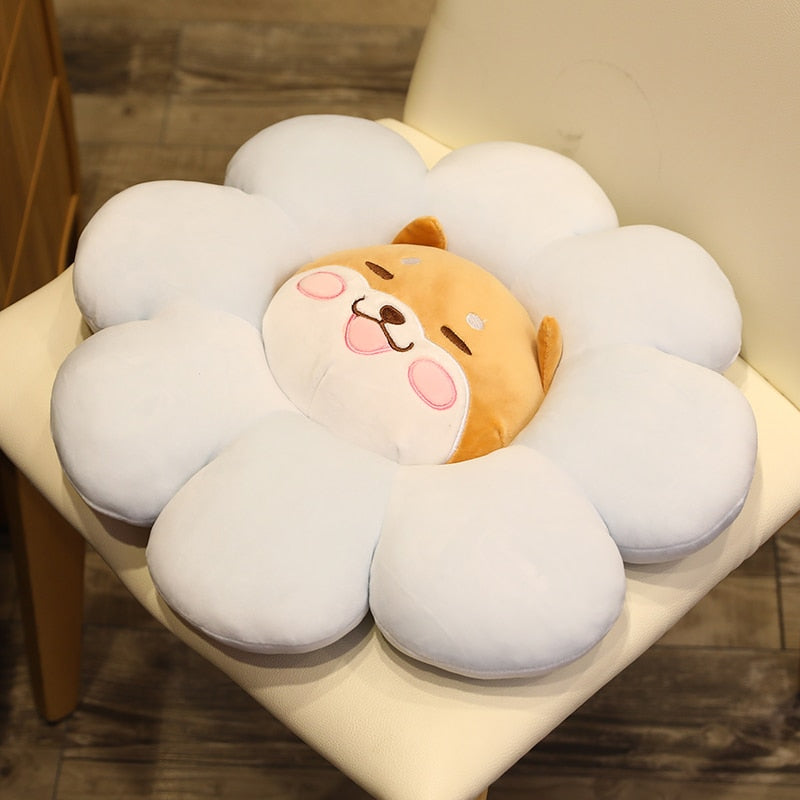 White plush flower pillow with sleepy bear face and soft tan nose detail