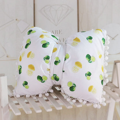 White bow decorative pillows with lemon print and pom pom trim, two-piece set