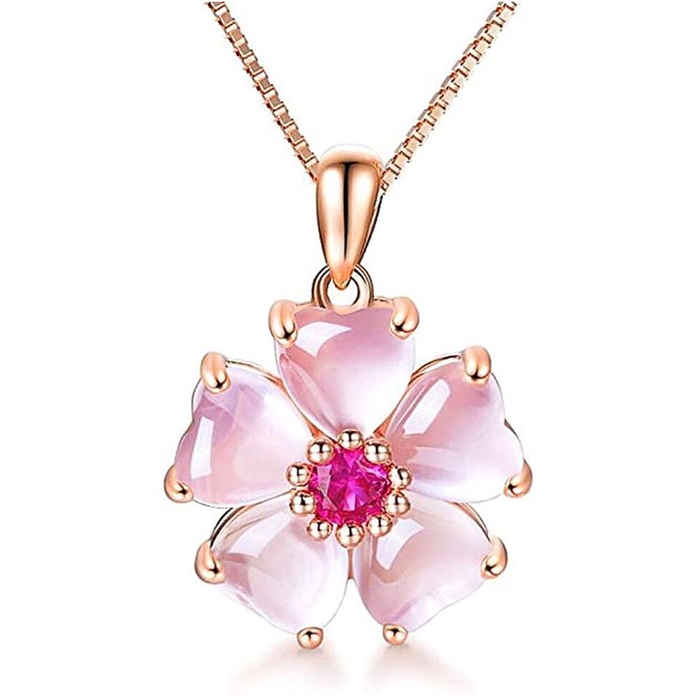 Sakura pendant necklace with rose-gold bail, pink petals, and fuchsia center.