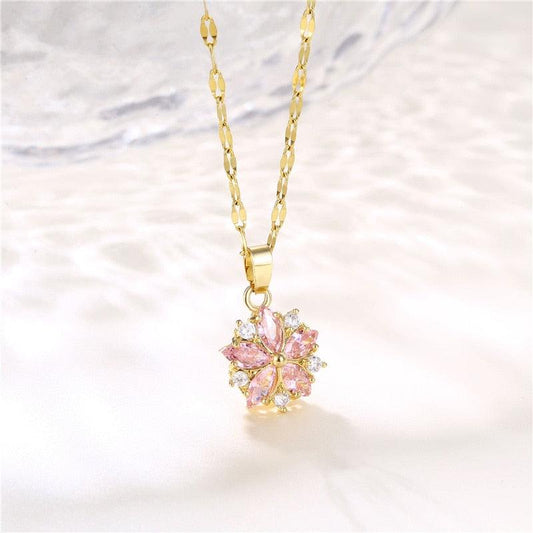 Gold-tone floral pendant necklace with pink flower center and clear crystal accents