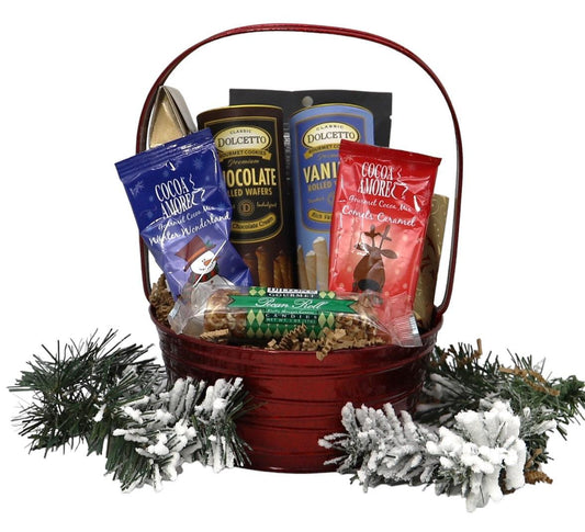 Small gift basket with assorted cookies, chocolate wafers, cocoa, and winter greenery