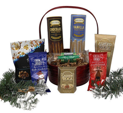 Small gift basket with rolled wafers, cocoa and nut snacks, plus winter greenery
