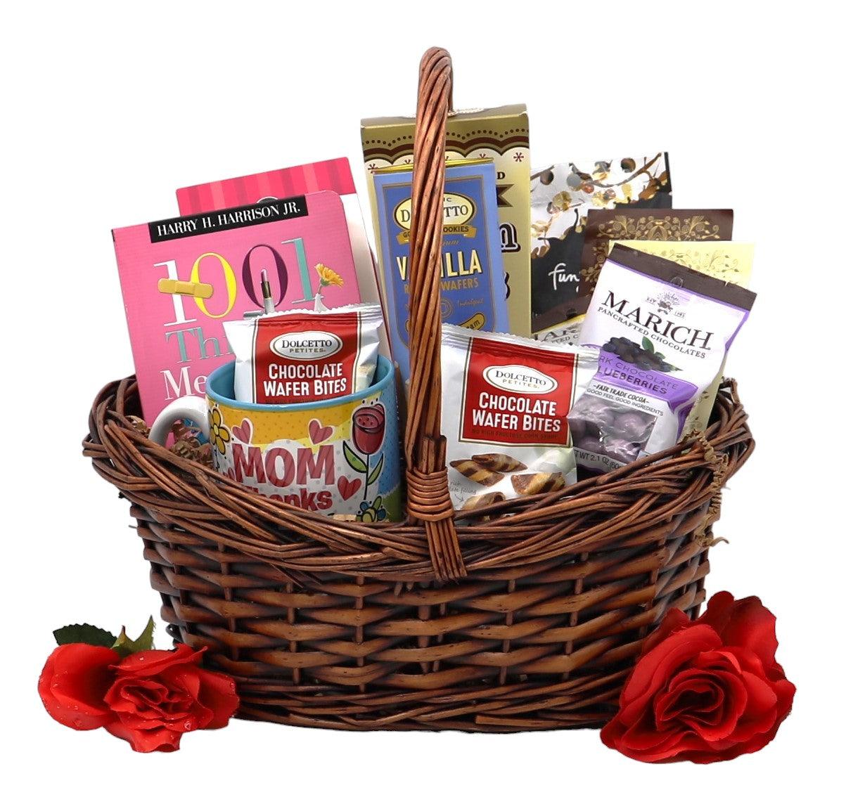 Wicker gift basket with assorted chocolates, candy bags, and red rose accents