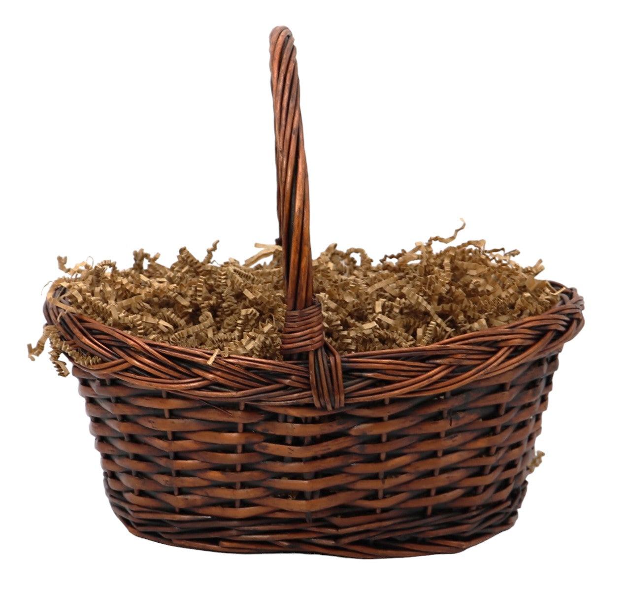 Wicker gift basket with tall handle and shredded paper filler