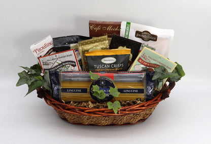 Italian gourmet gift basket in wicker basket with pasta, dips, chips, and chocolates