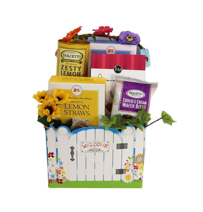 Welcome Home gift basket with welcome fence front and assorted lemon treats