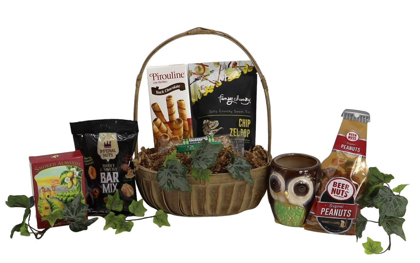Gift basket with wicker handle, chocolate and nuts, and an owl mug with drink.