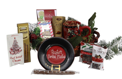 Christmas gift basket assortment with candies and a black festive plate