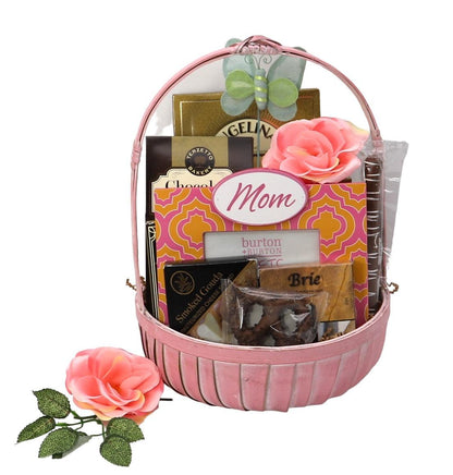 Mother’s gift basket with pink handle and floral topper, filled with chocolate treats