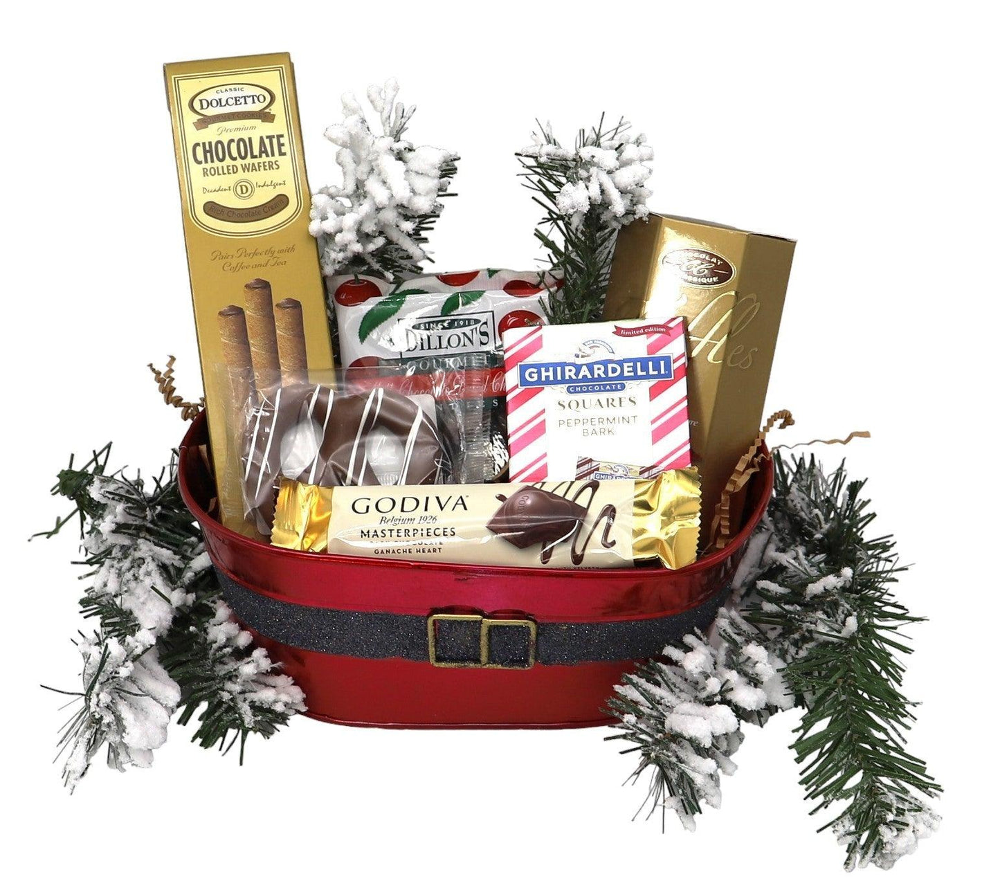 Christmas gift basket with red tray, snowy pine garlands, and assorted chocolate