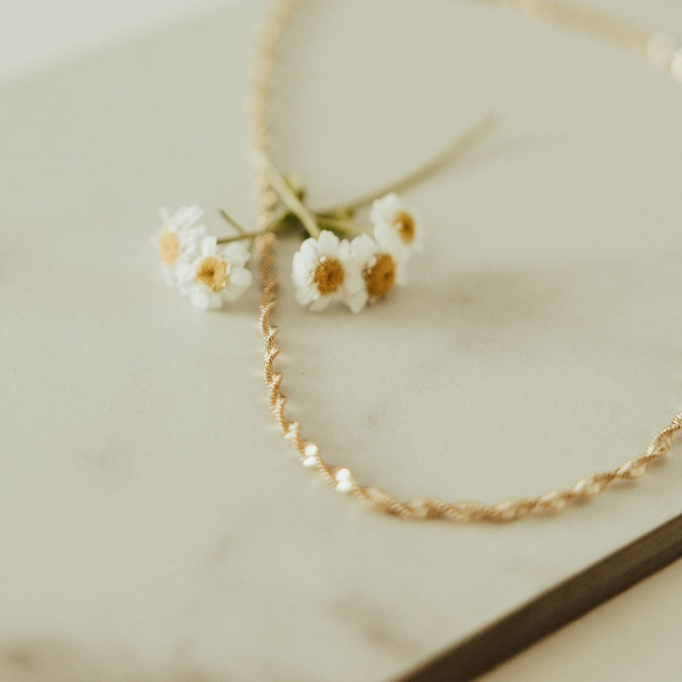 Close-up of the necklace's twisted gold-filled chain.