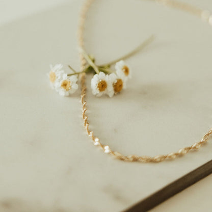 Close-up of the necklace's twisted gold-filled chain.