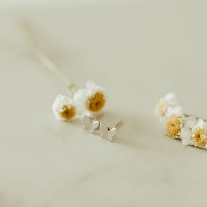 Pair of silver butterfly mini studs with slim post backs