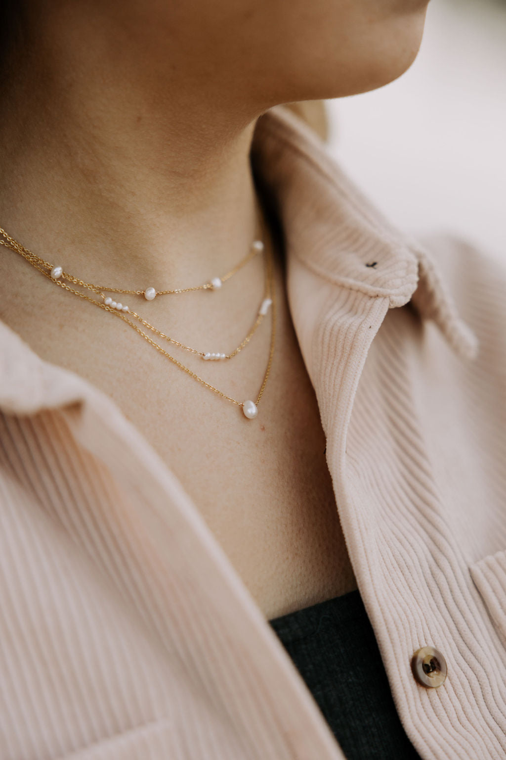 Melbourne Pearl Necklace shown in a layered look with delicate pearl details