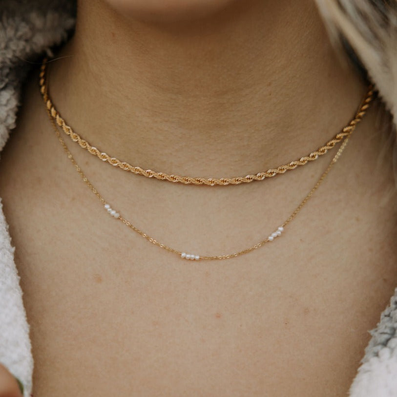 Gold-filled rope necklace layered above a fine beaded chain.