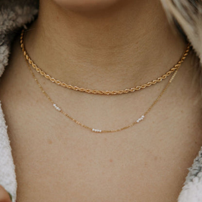 Gold-filled rope necklace layered above a fine beaded chain.
