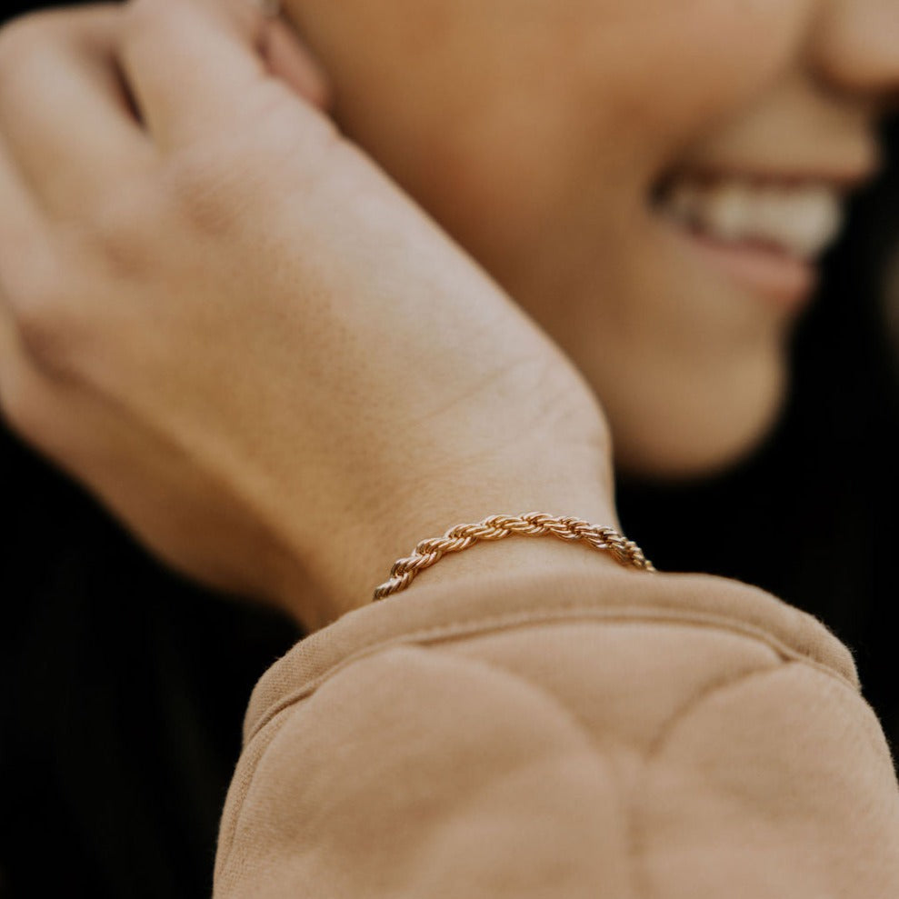 Naomi gold filled bracelet with a close-up view of its twisted rope chain