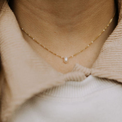 Melbourne Pearl Necklace with a gold-tone chain and vertical oval pearl pendant