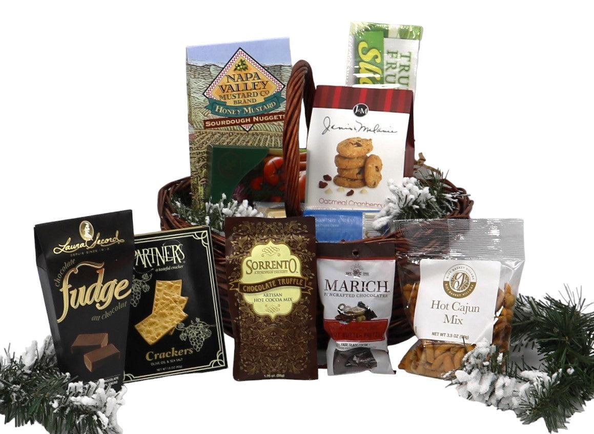 Christmas gift basket with assorted packaged treats and hot cocoa mix, arranged in a woven tray