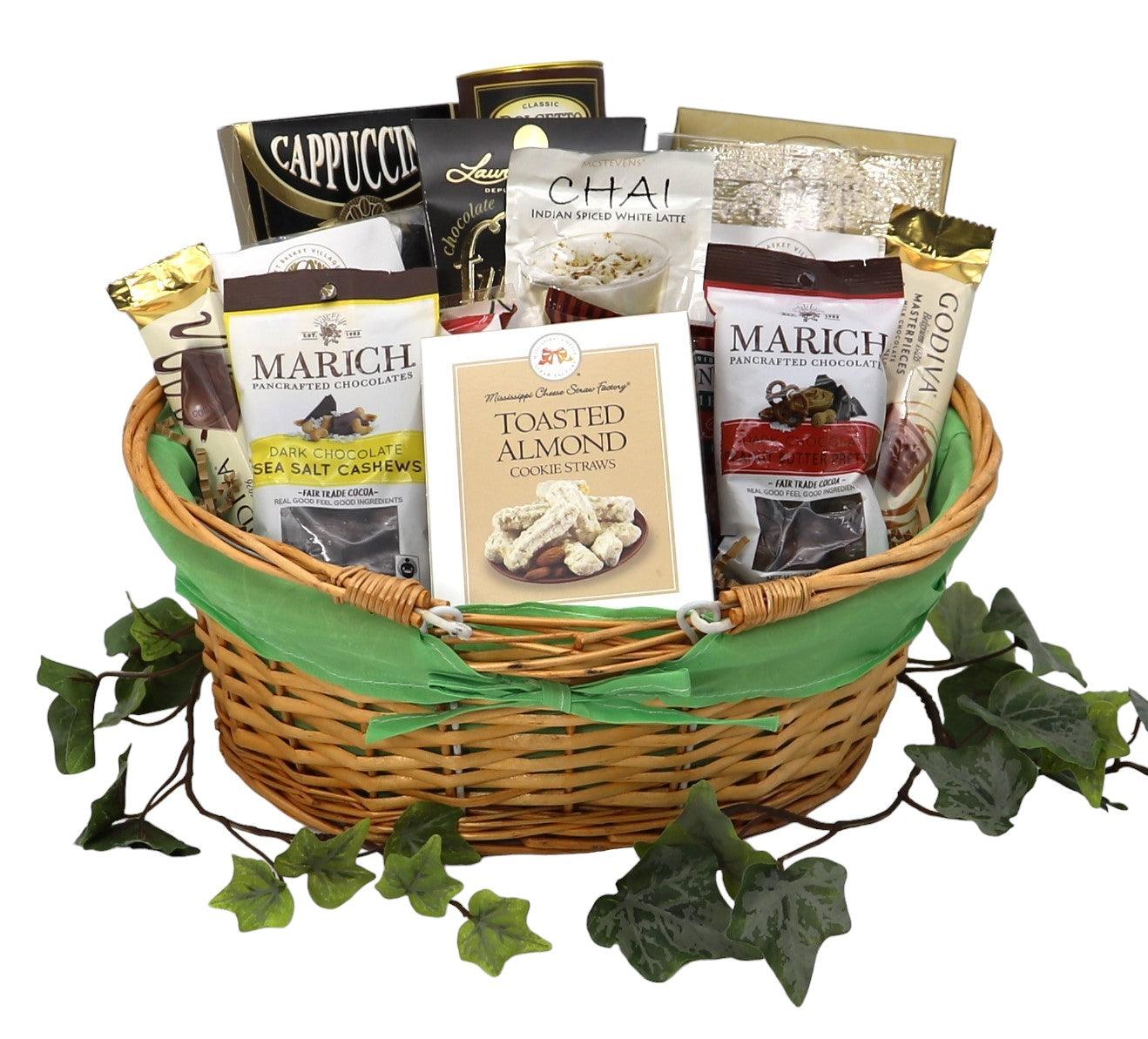 Wicker gift basket filled with coffee, hot drinks, chocolate, almonds, and gourmet snacks