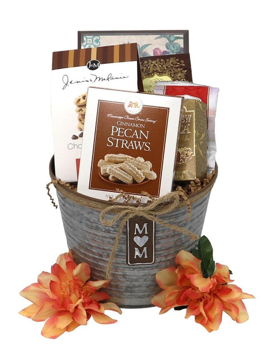 Mom gift tin with gray wrapped container, flowers, and assorted snack packages inside.