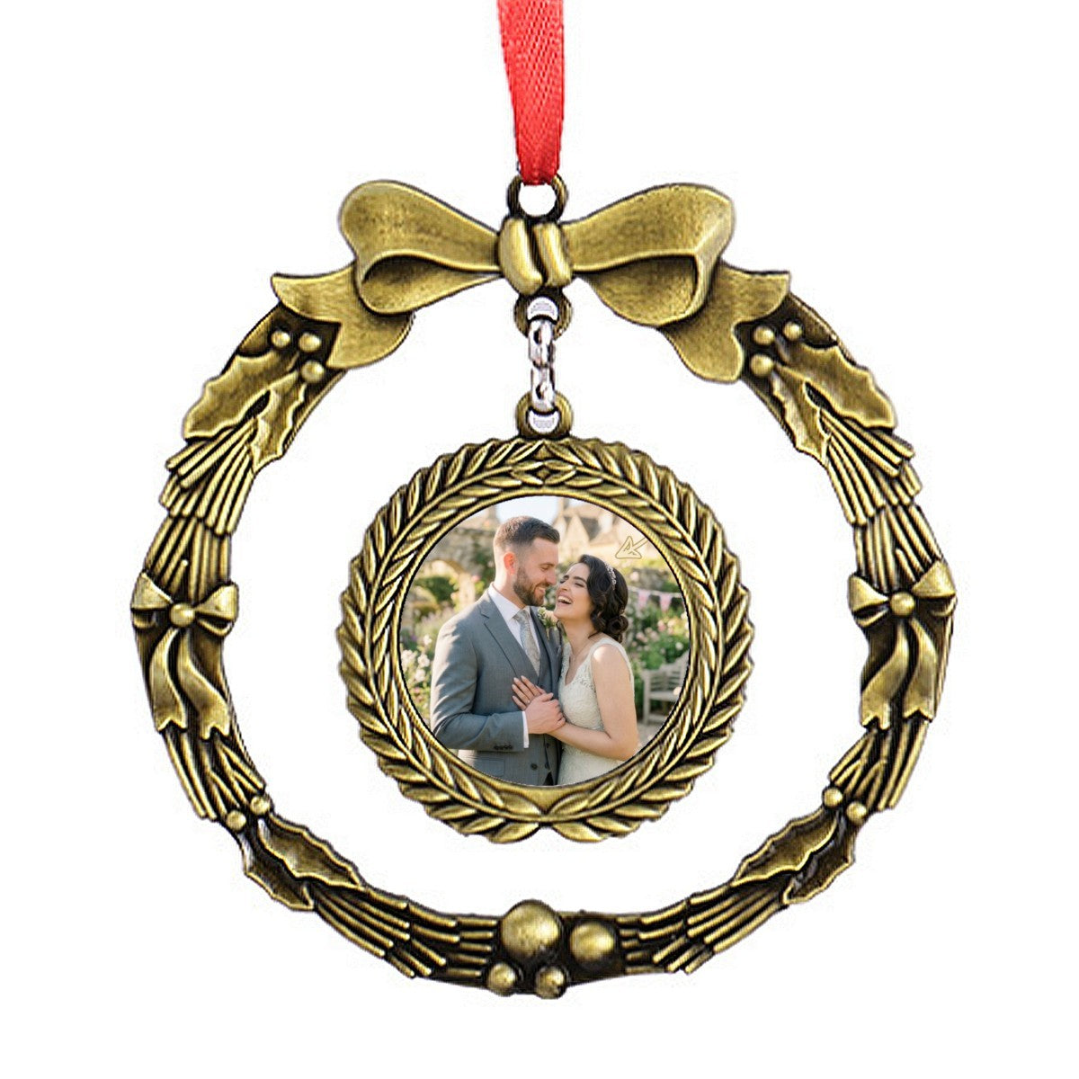 Golden wreath-style photo ornament with bow and hanging red ribbon