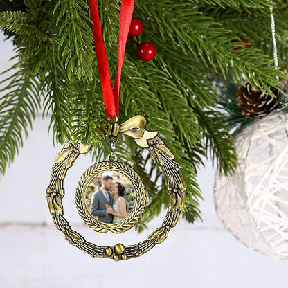 Golden wreath photo ornament with bow and portrait medallion on a red ribbon