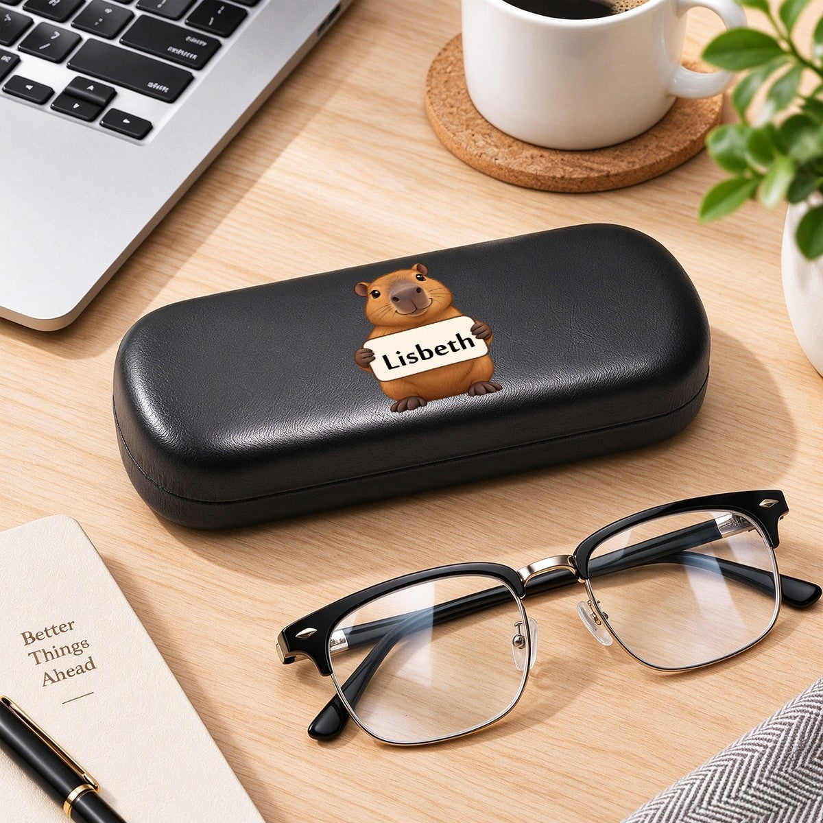 Black eyeglasses case with capybara graphic and name tag "Lisbeth"