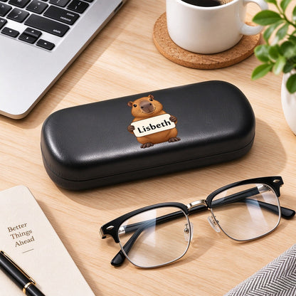 Black eyeglasses case with capybara graphic and name tag "Lisbeth"