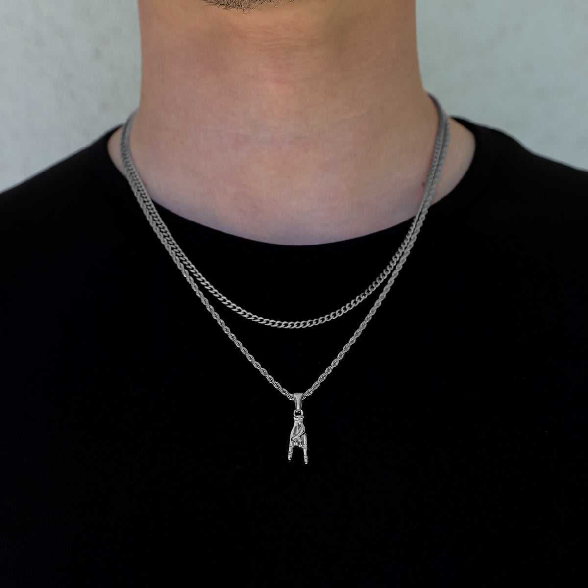 Silver layered necklace set with horn-hand pendant