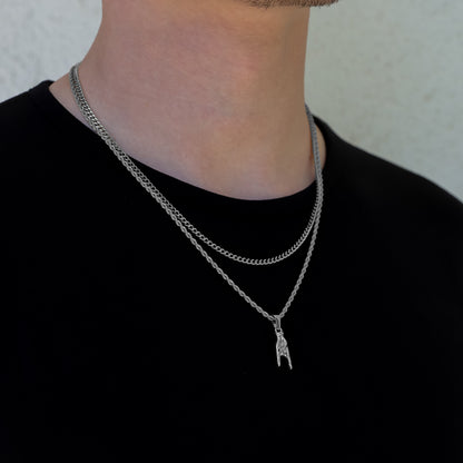 Silver pendant necklace set with horn-hand charm and layered chain