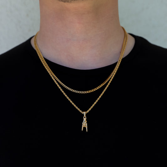Gold pendant necklace set with horn-hand charm and layered chain