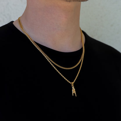 Gold layered necklace set with small horn-hand pendant