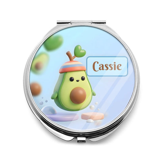 Silver compact mirror with a colorful avocado character and Cassie name on the lid