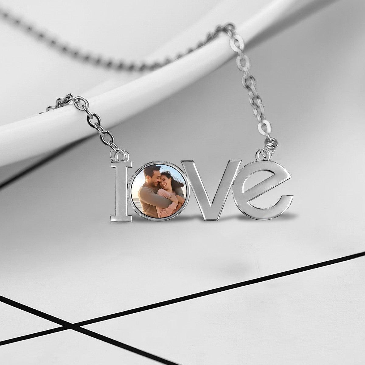 Silver LOVE photo pendant necklace close-up of LOVE charm and photo locket