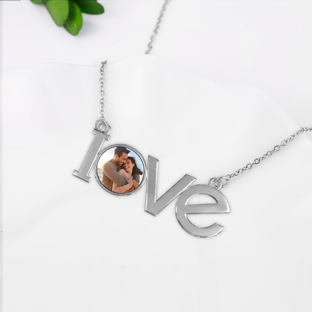 Silver LOVE photo pendant necklace with openwork letters and round photo locket