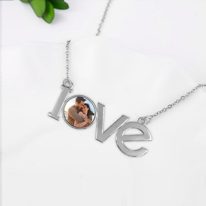 Silver LOVE photo pendant necklace with openwork letters and round photo locket
